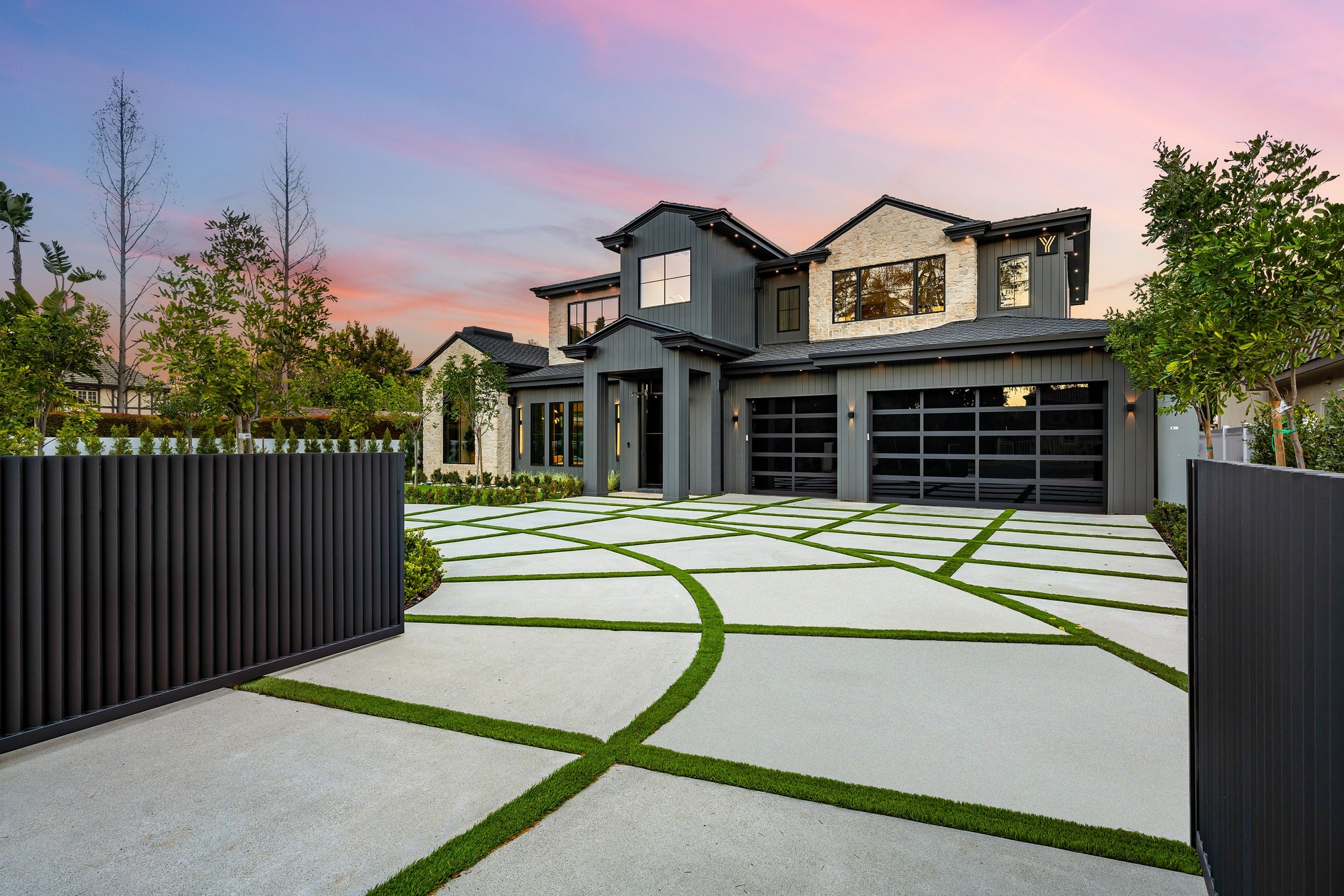 Modern house with designed driveway at sunset